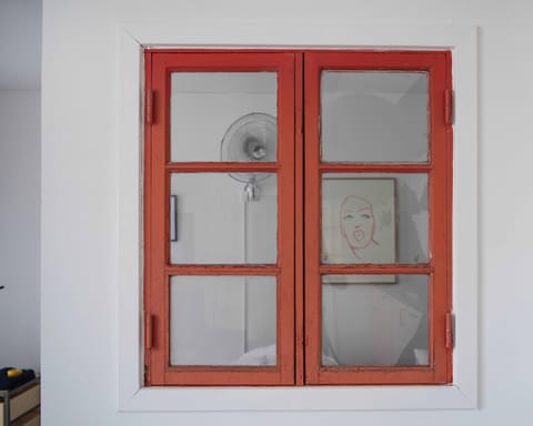 The Rust red window to the bedroom