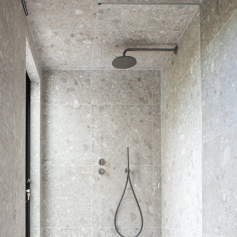 The stone bathroom with a rainfall shower