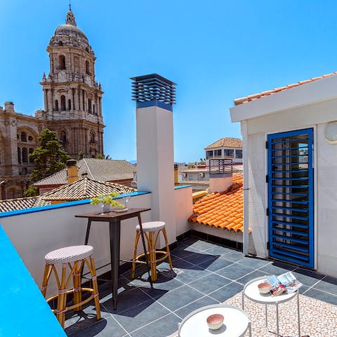 Soak up views of Málaga Cathedral from your private terrace