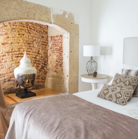 Feel the history of the home with the exposed alcove in the bedroom