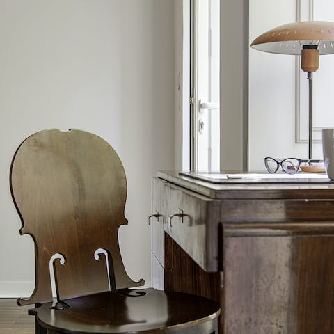 Write a journal of your stay in Lisbon at the desk with its cello chair