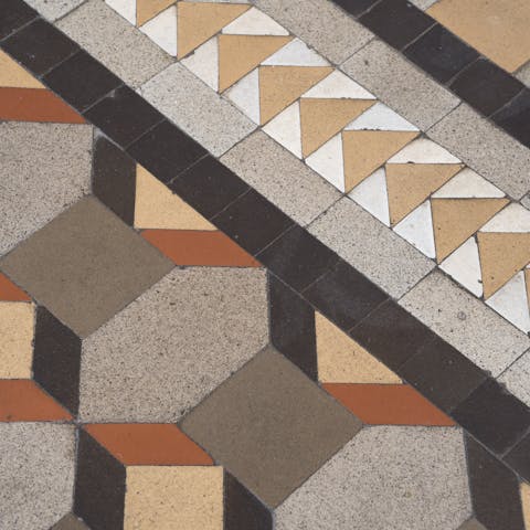 Admire the striking colours and patterns of the original hydraulic tiles