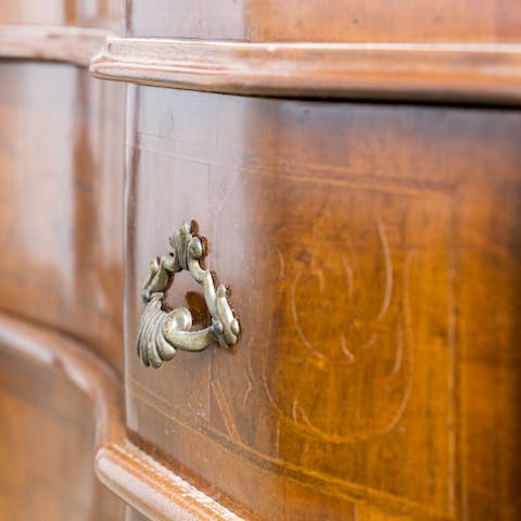 Admire high-quality, antique furniture and tasteful details throughout the home