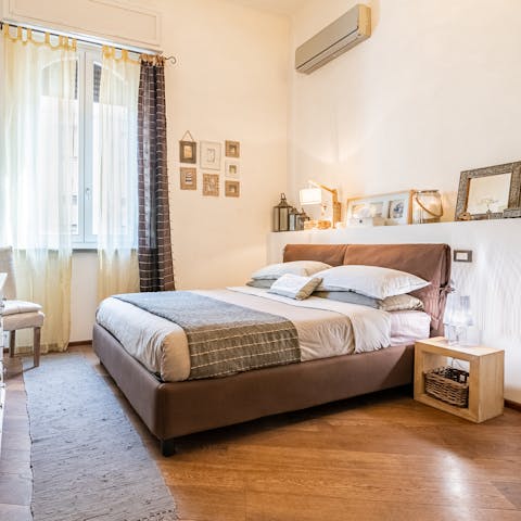 Get some rest in the comfy bedroom after a busy day exploring Pisa