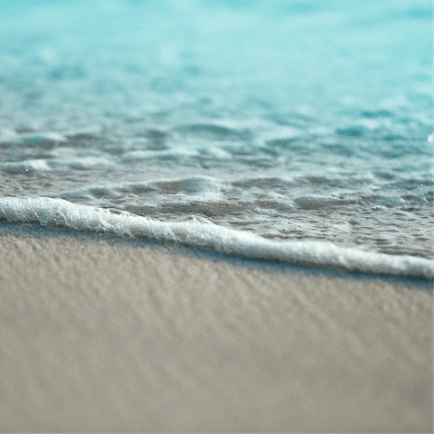 Enjoy a day at the beach with a good book and the sand beneath your toes, it's a short walk away