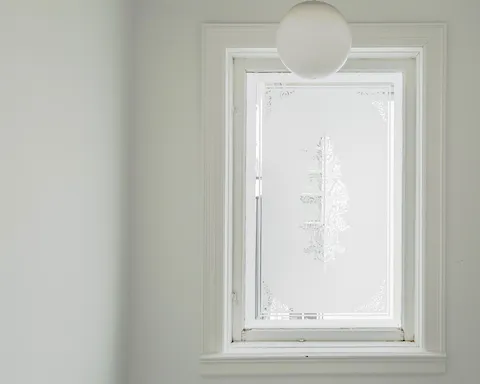 This charming etched glass window