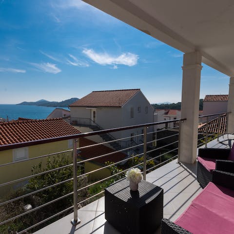 Head out to the lounging balcony for rattan sofas and loungers with an Adriatic view