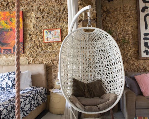 Get comfortable in the stylish hanging chair with a good book or glass of wine
