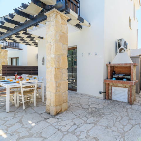 Throw a barbecue and dine alfresco in the outdoor dining space by the pool
