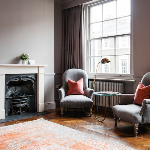 Savour a cup of tea or curl up with a book in the armchairs by the window