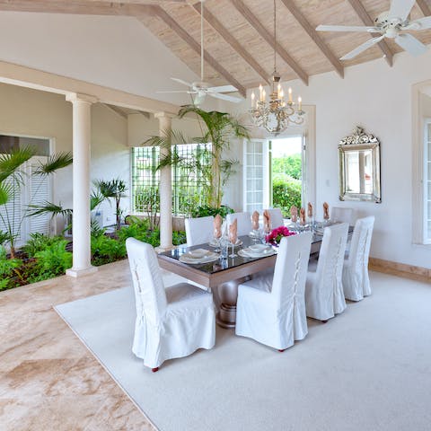 Enjoy a languorous dinner with the company of tropical plants in the open-air dining room