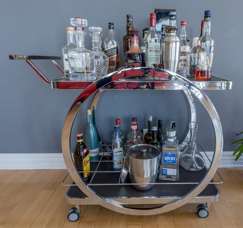 Mix up a few drinks on the well-stocked bar cart
