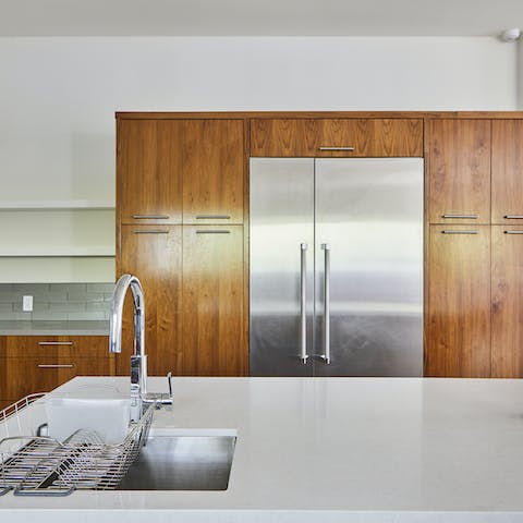 Immaculate wooden and steel kitchen finishes