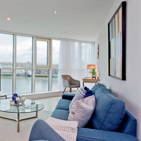 Take in views of the Thames from the comfort of the living area 