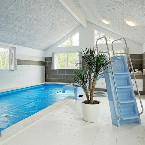 Slide into the indoor pool no matter the weather outside