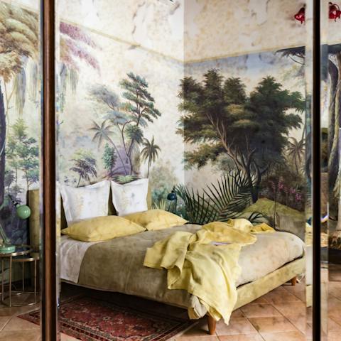 Marvel at the stunning scenes printed on the wallpaper in the bedroom