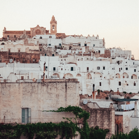 Explore the whitewashed old town of Ostuni, fifteen minutes away by car