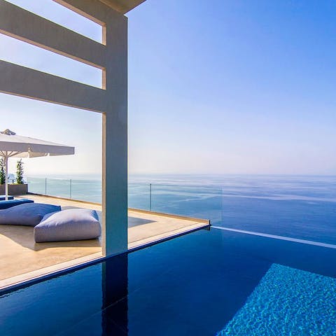 Make the most of your crystal-clear infinity pool, which seems to melt into the sea