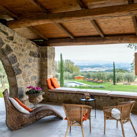 Admire the rolling landscape on the horizon from the covered veranda 