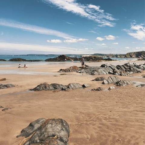 Enjoy swimming and surfing at Newquay Beach, a nine-minute walk away