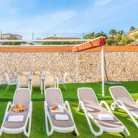 Spend lazy afternoons on the poolside loungers
