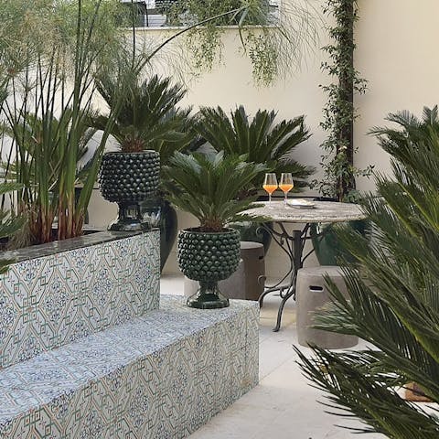 Relax with a glass of Marsala in the lush communal garden