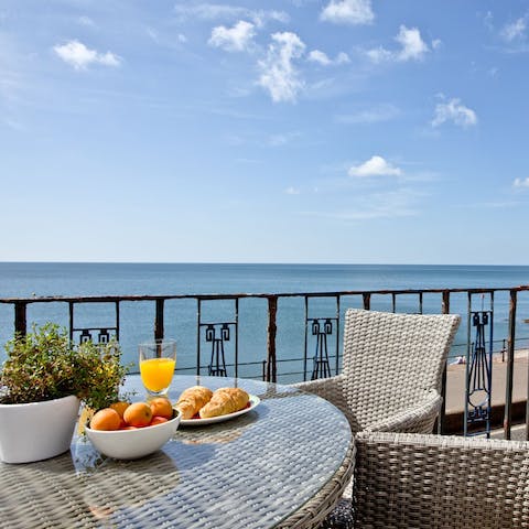 Watch the waves roll in as you tuck into breakfast on your balcony