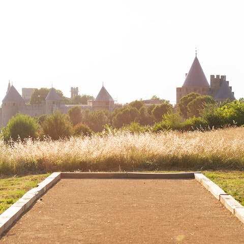 Play a game of pétanque on the private court