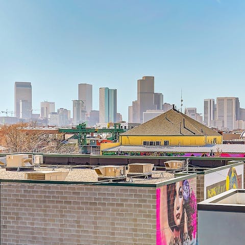 Soak up views of  RiNo's street art with the Denver skyline in the distance