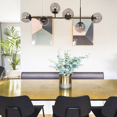 Come together around the brass-clad dining table for memorable  mealtimes