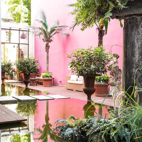 Relax in the beautiful, communal inner courtyard with its fish pond and statues