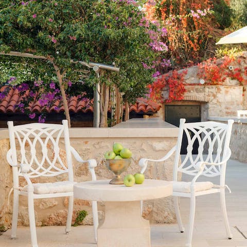 Eat alfresco in your pretty courtyard surrounded by flowers
