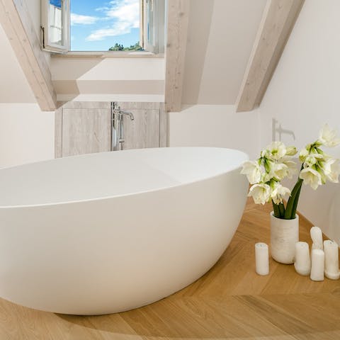 Relax in one of the home's luxurious, freeform bathtubs