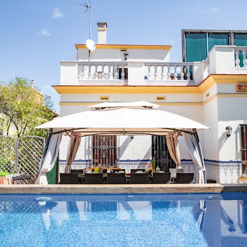 Dine around the private pool in the Barcelona sunshine at the alfresco dining area