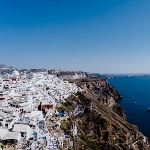 Sample the bars and restaurants of Fira, a few metres away