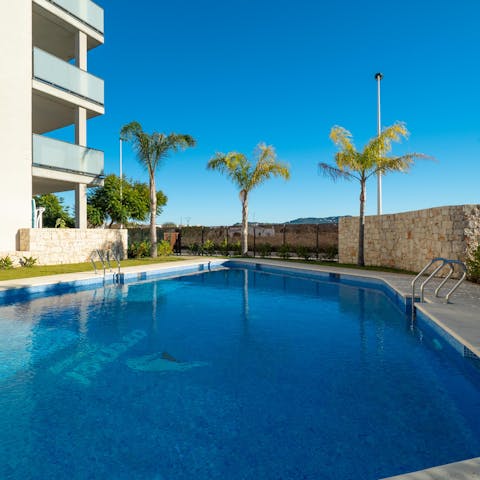 Take a dip in the tree-lined communal pool where you might like to socialise