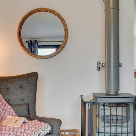 Snuggle up with a book and stay cosy by the wood burning stove