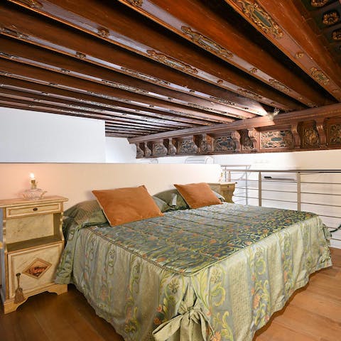 Relax in your cosy bedroom, and admire the original carved beams  