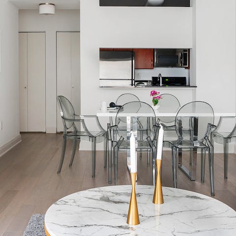 A dining table with medallion chairs