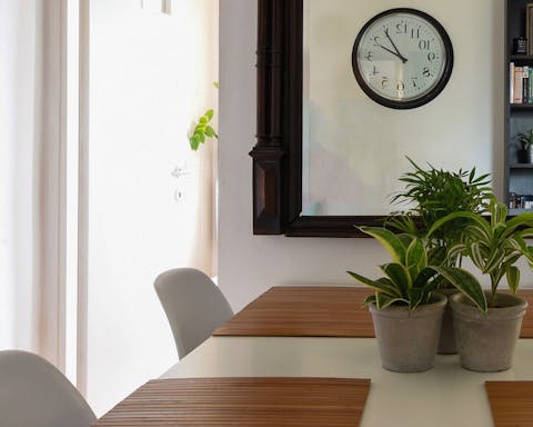 The Eames-style chairs around the dining table