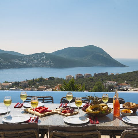 Dine alfresco, soaking up the sun as the sea stretches out before you