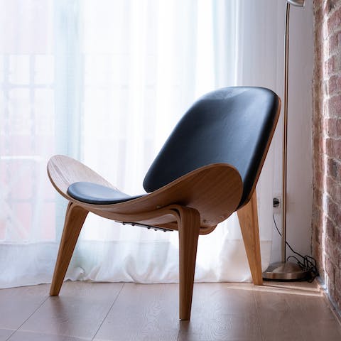 Find a sunny spot to enjoy a good book on the Wegner-inspired chair