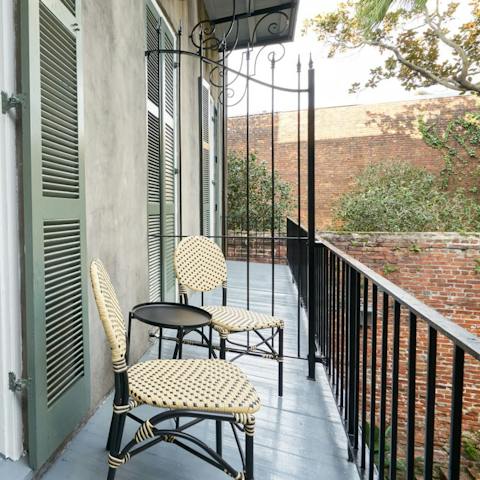 Sip a glass of bourbon on your private balcony 