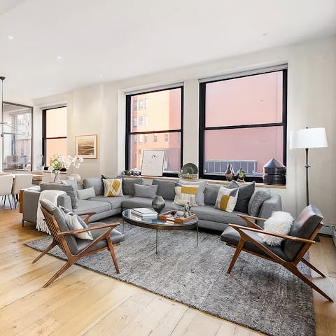 Snuggle up in the sun-flooded living area after sightseeing around NYC