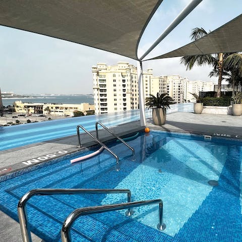 Take a soak in the communal rooftop swimming pools