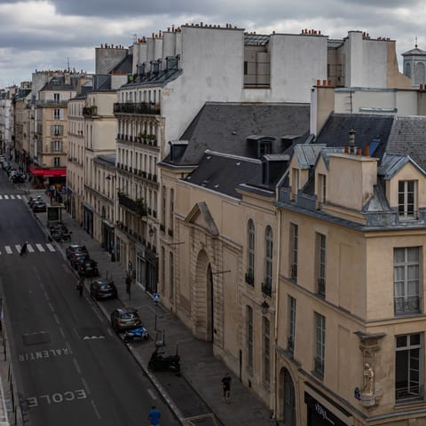 Wake up to views of the pretty Parisian architecture of rue de Turenne 