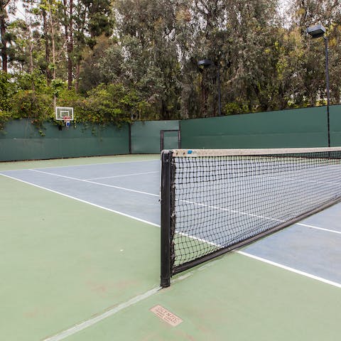 Work on your troublesome backhand on the home's tennis court