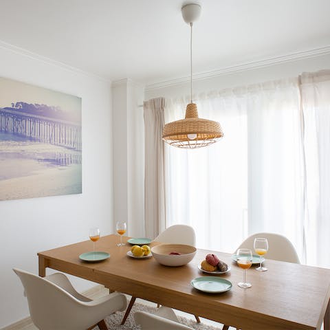 Enjoy a leisurely dinner in the bright white dining room