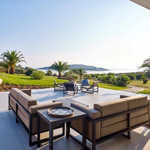 Take in your peaceful island surroundings from the lounge on the terrace