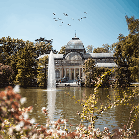 Stroll around the lake at nearby El Retiro Park